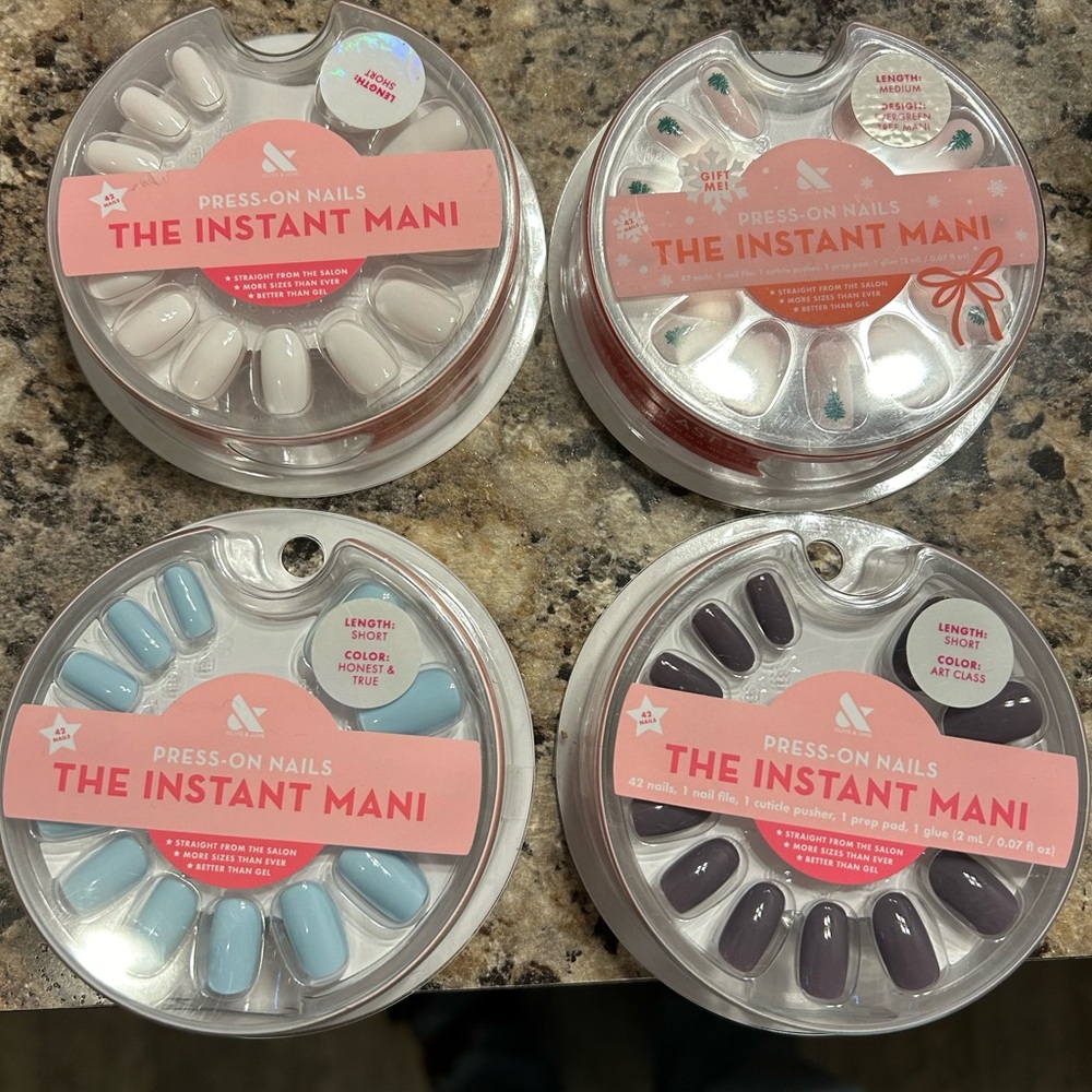 4 sets of glue press on Olive & June nails. New in package not opened.